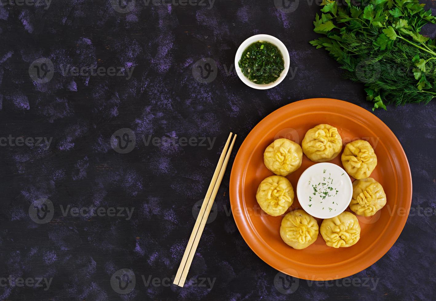Delicious manti dumplings on dark background photo