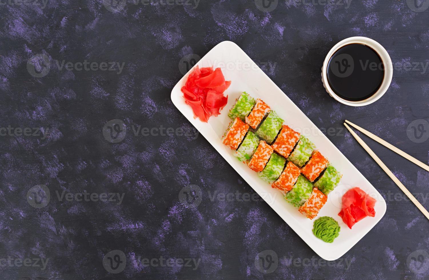 Sushi roll on dark background. Top view photo