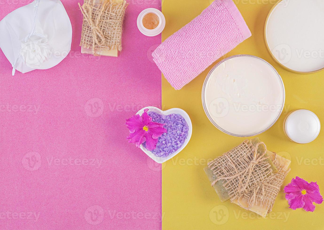 Set cosmetics SPA.  Mockup on pink-yellow background, place you design. Top view photo