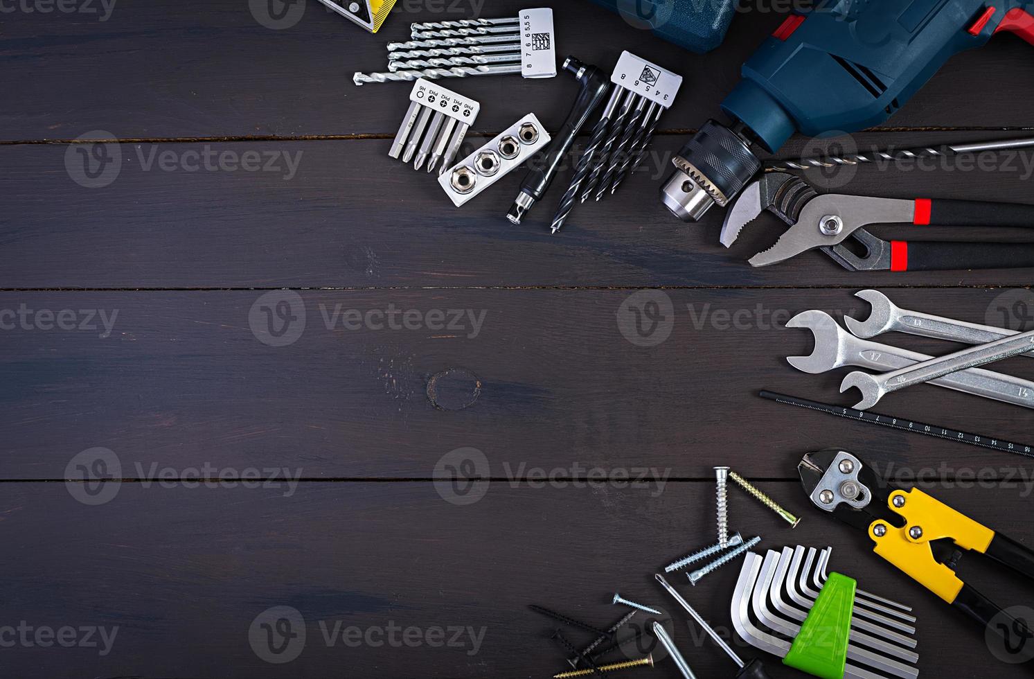 Working tools on wooden rustic background. Top view. Copy space photo