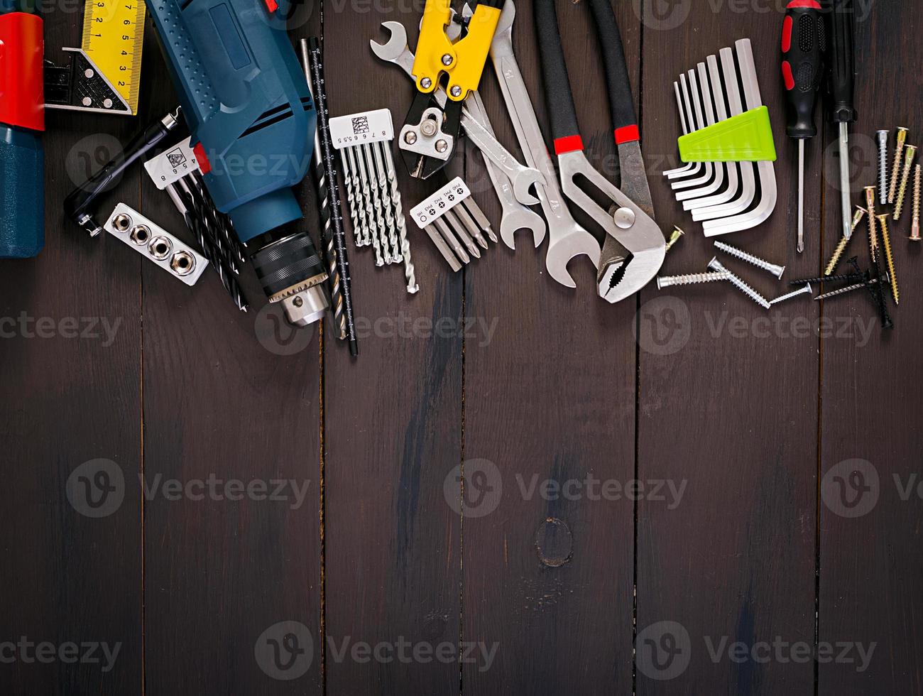 Working tools on wooden rustic background. Top view. Copy space photo