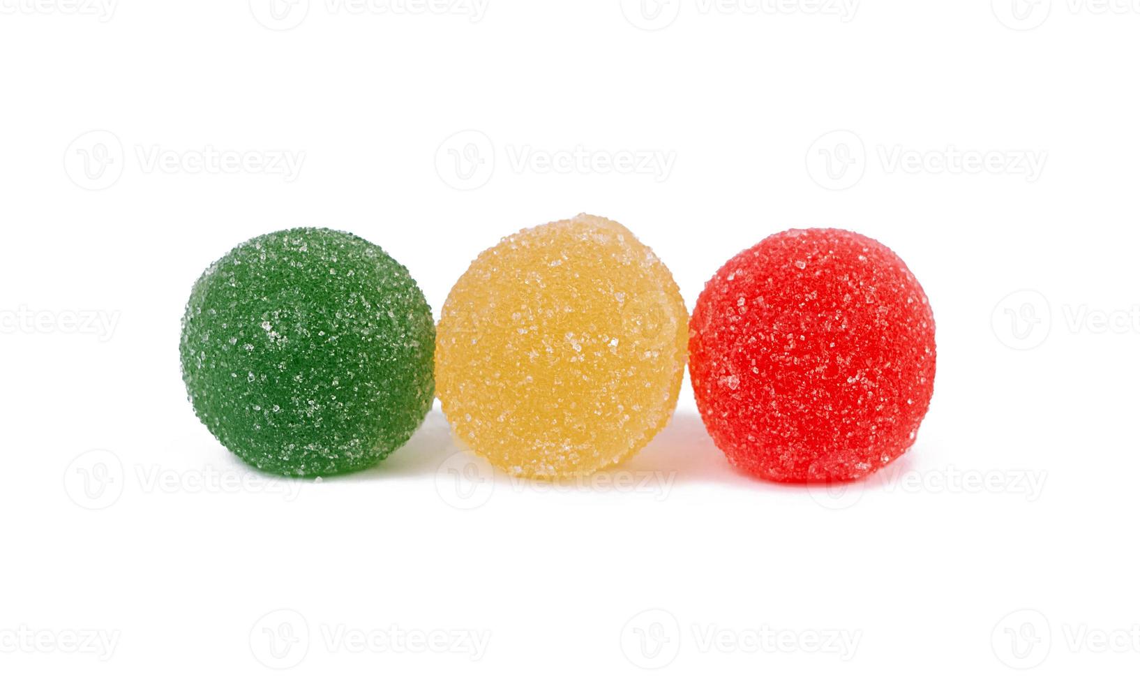 Colorful marmalade isolated on white background. Delicious jujube balls. photo
