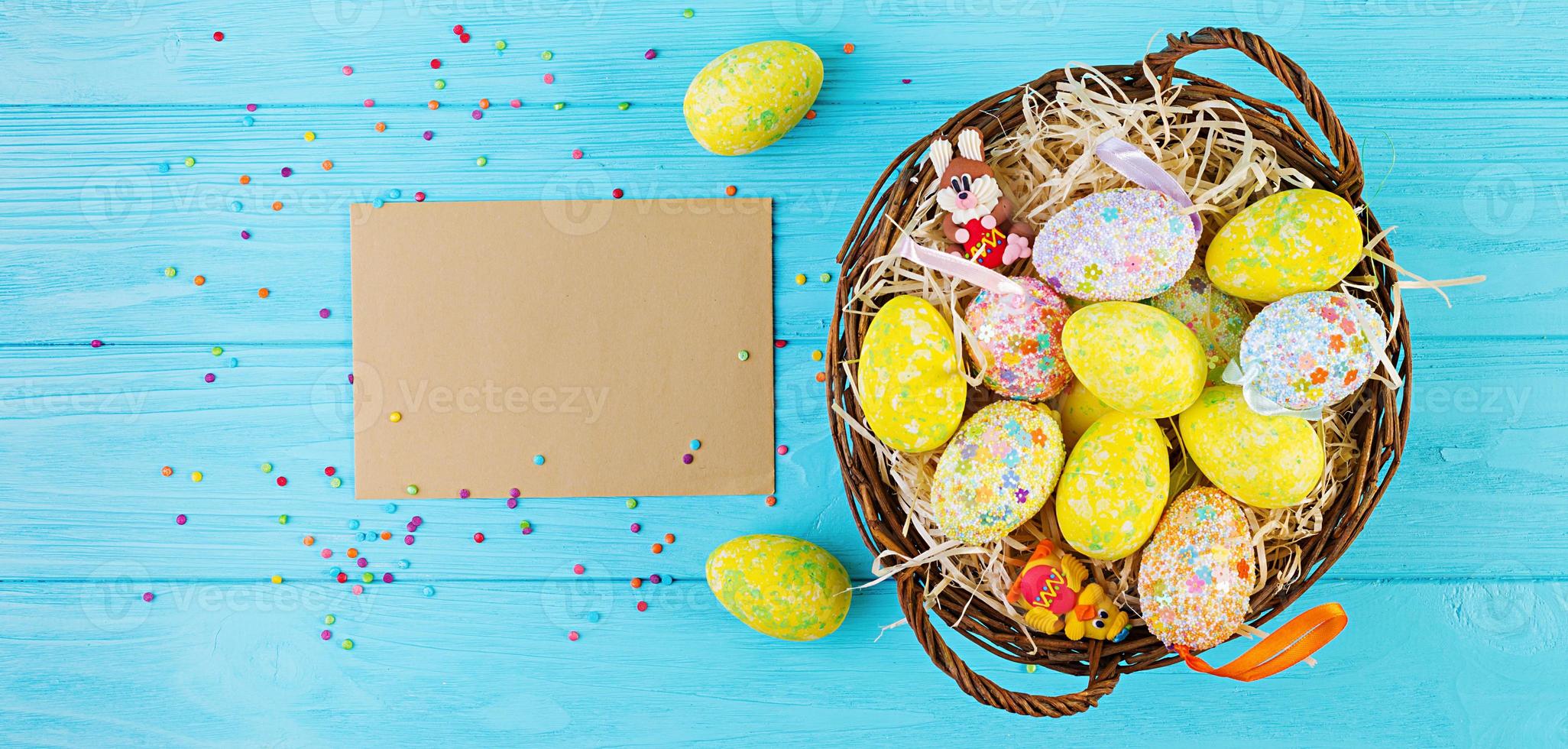 Banner with easter background. Background with flowers and easter eggs. Top view photo