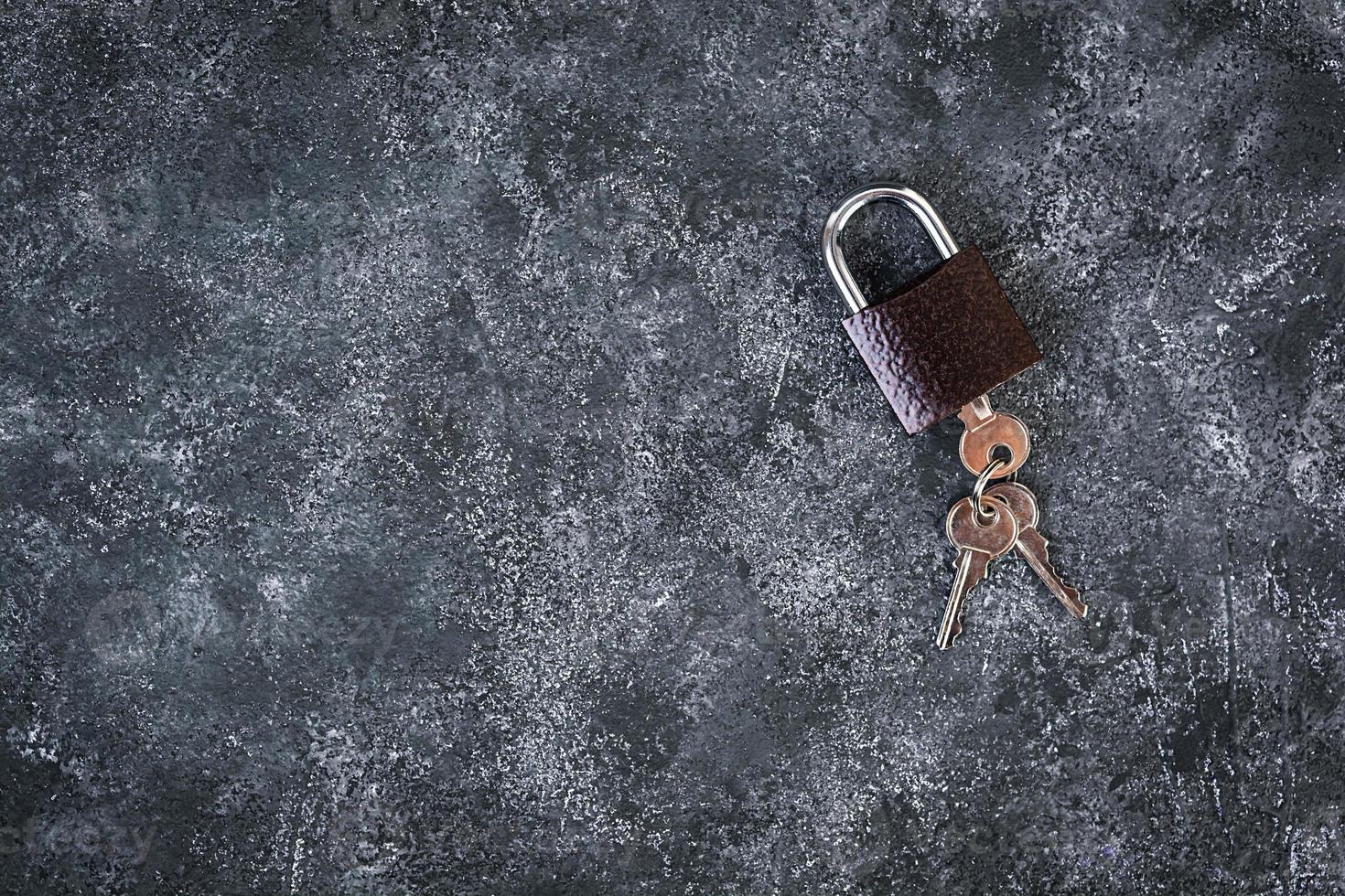 Iron lock with keys on grey background. Top view. photo