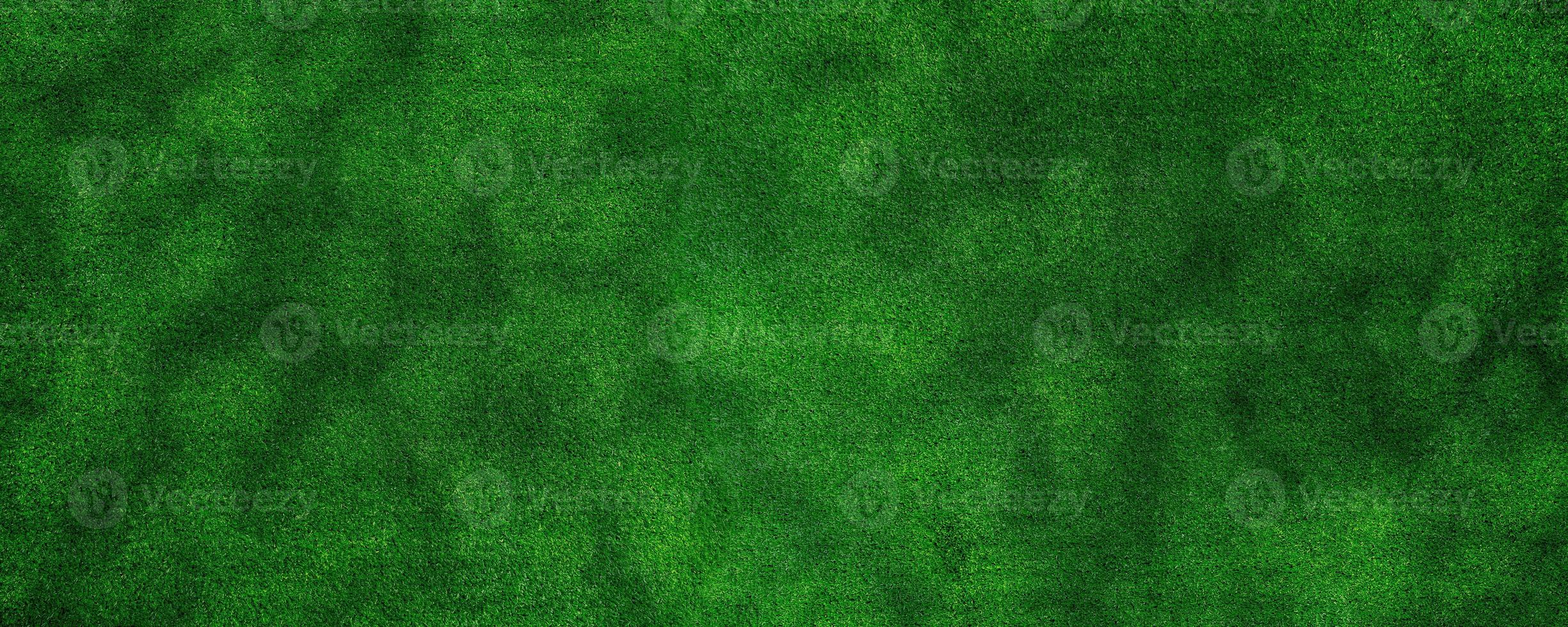 Panorama green artificial grass texture background for decorating the interior or exterior of the garden at home. photo