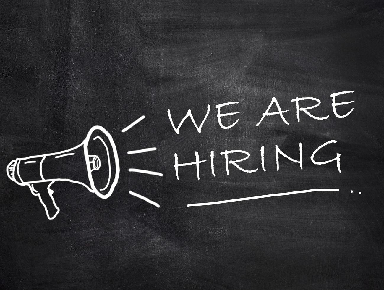We are hiring text with megaphone on chalkboard background. photo