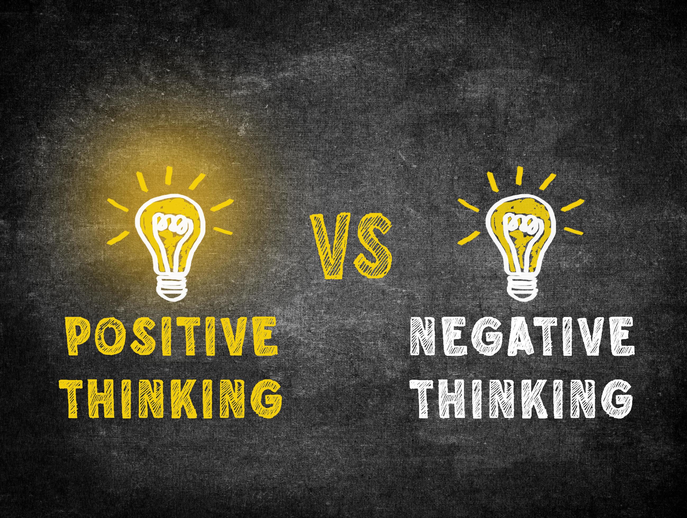 Positive thinking and Negative thinking light bulb concept on black