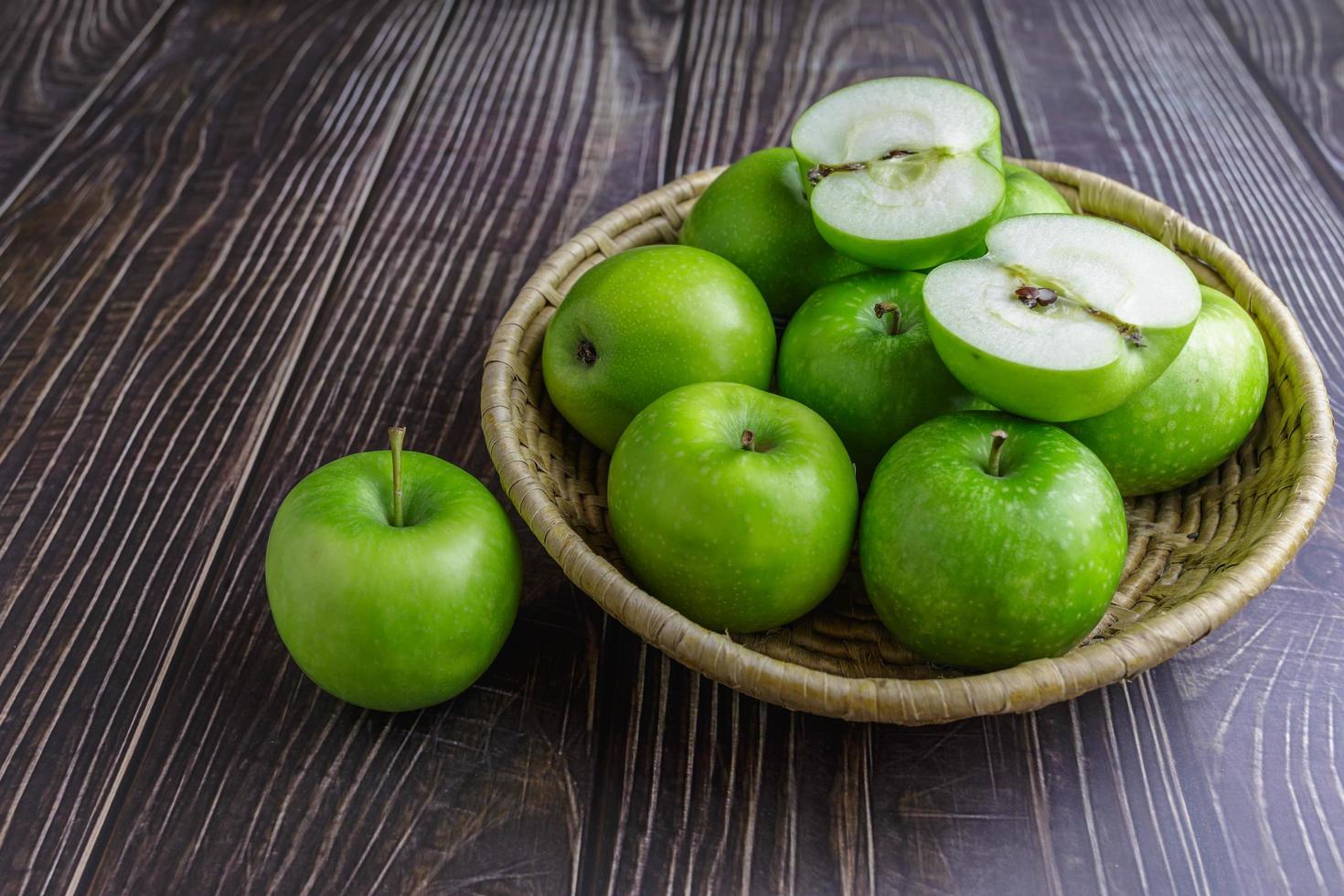 Green apples in a basket photo