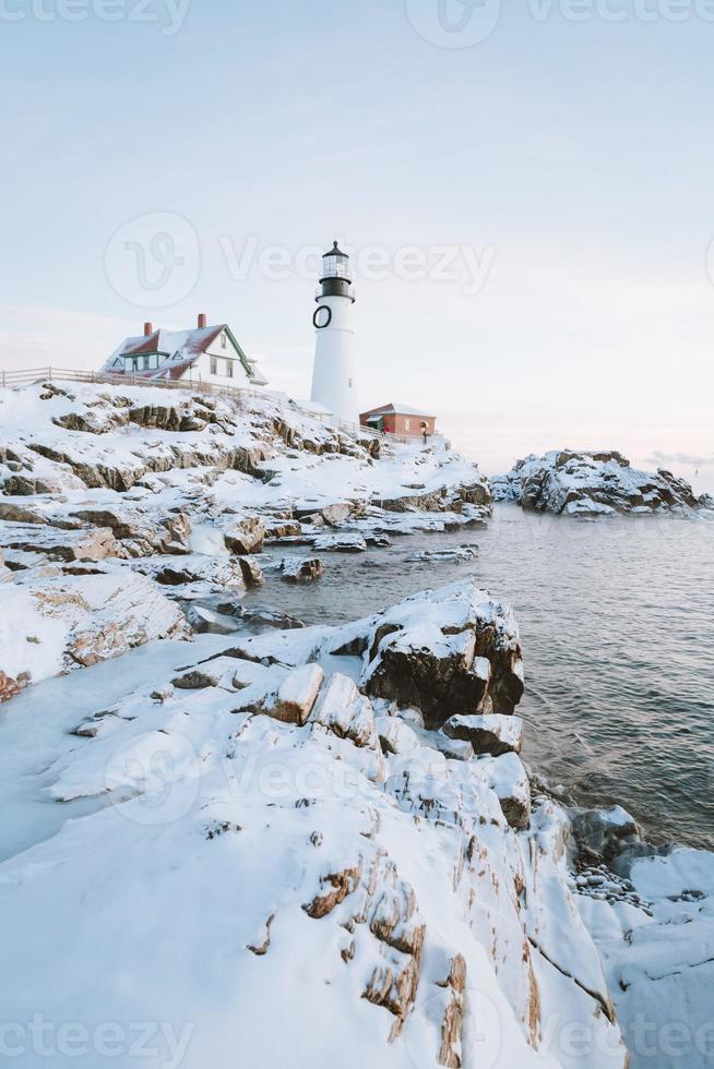 Lighthouse in a snowy landscape photo