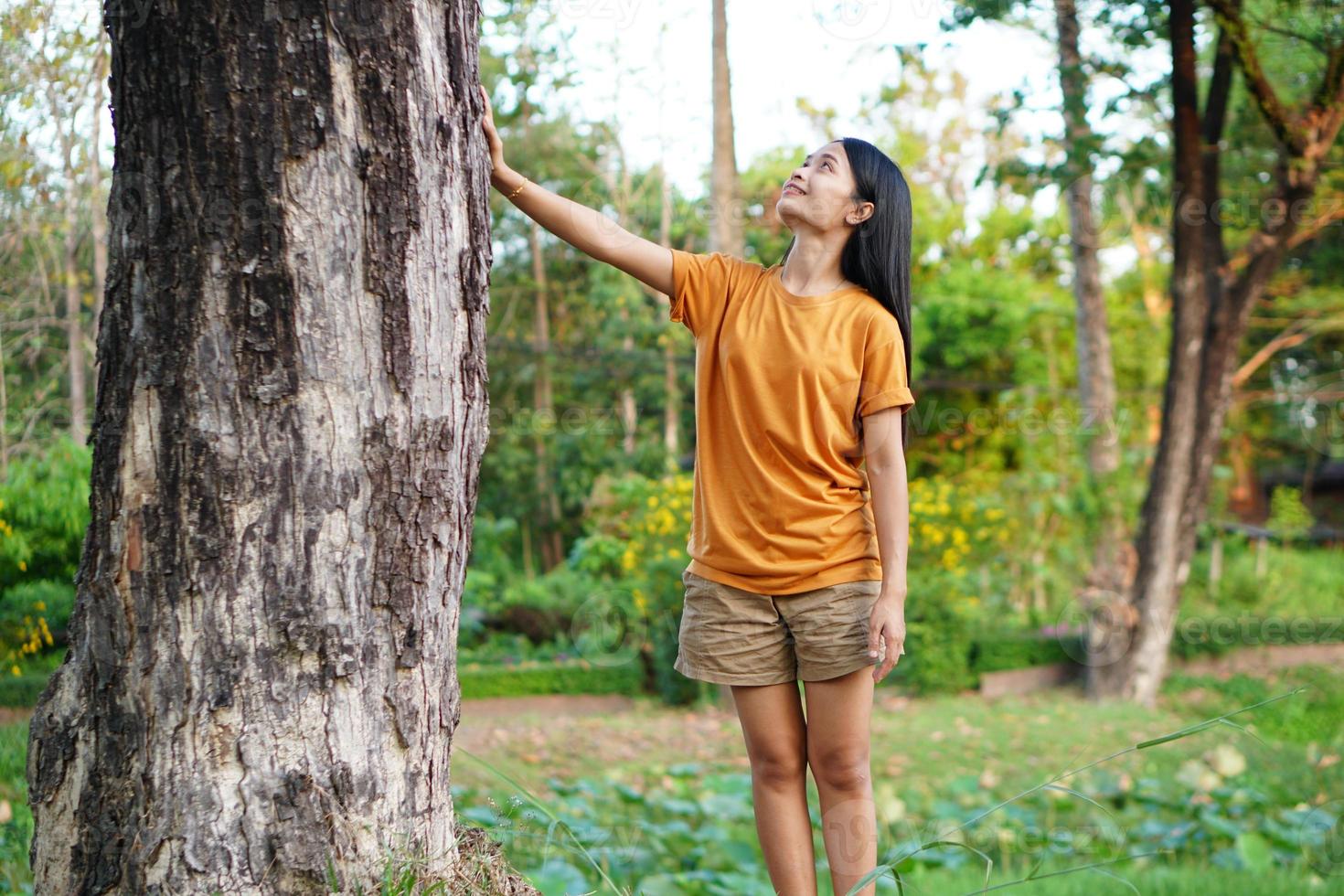 Asian women huging trees , the concept of love for the world photo