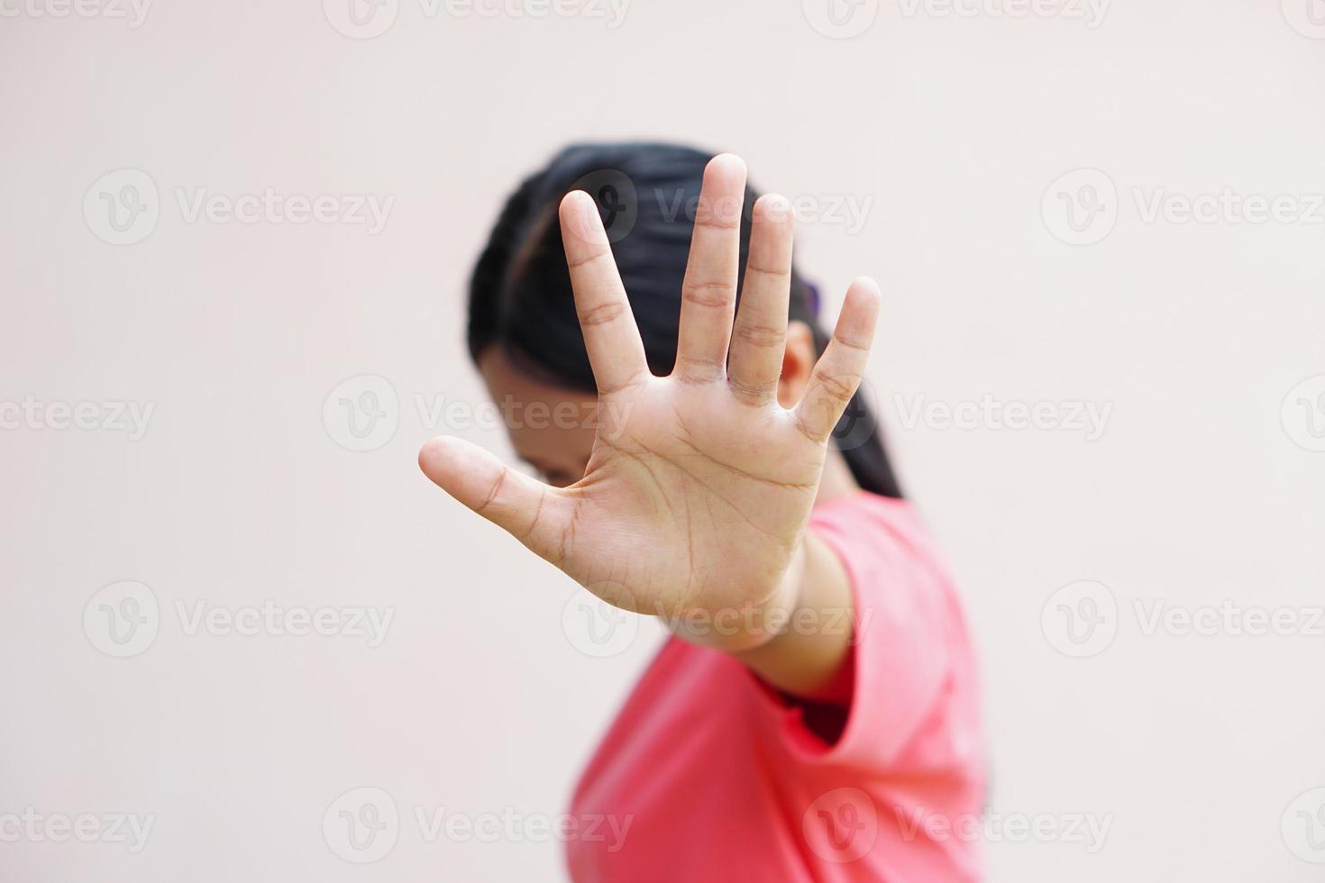 Woman raised her hand for dissuade, campaign stop violence against women photo