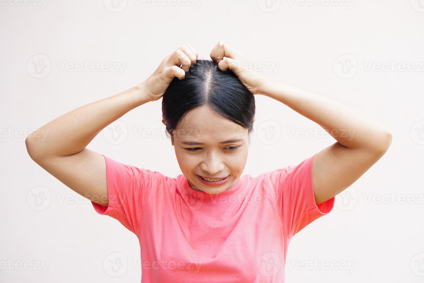 woman has itching on her head. photo