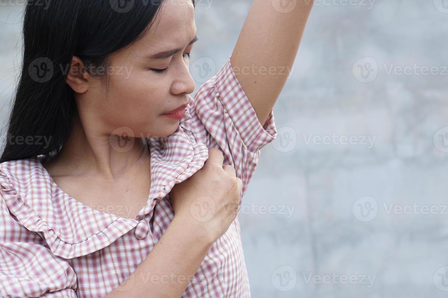 Itchy woman with armpit photo