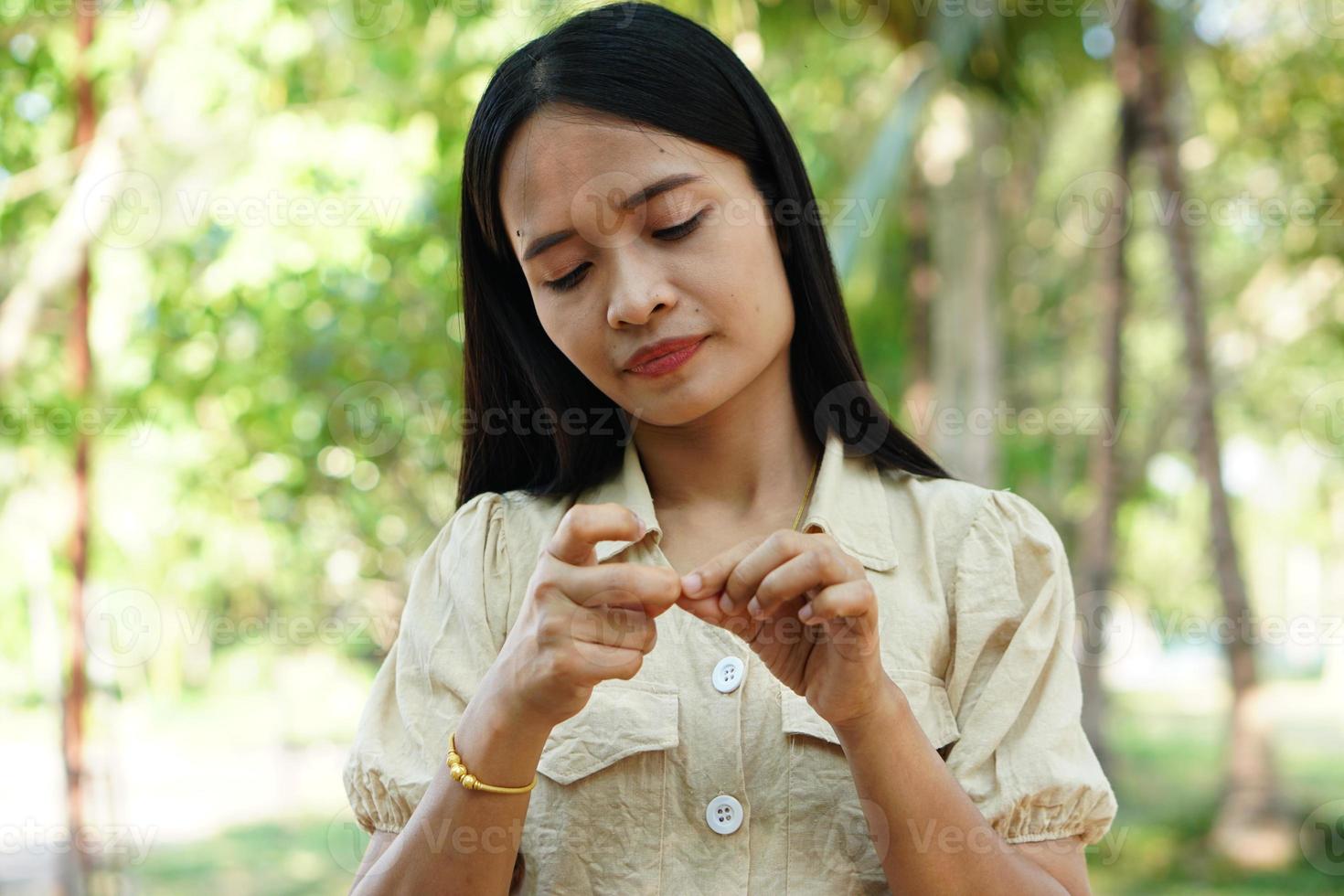 Woman scratching arm from itching photo