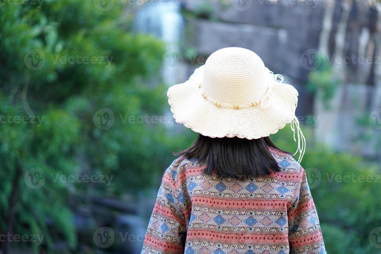 Female tourist on the mountain looking at nature photo