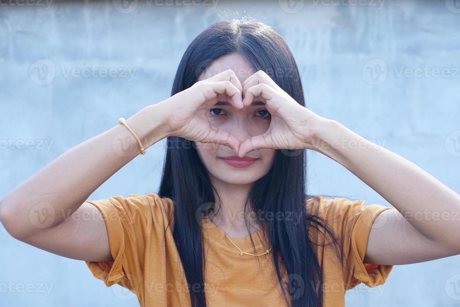 Asian woman wearing a hat smiling happily photo