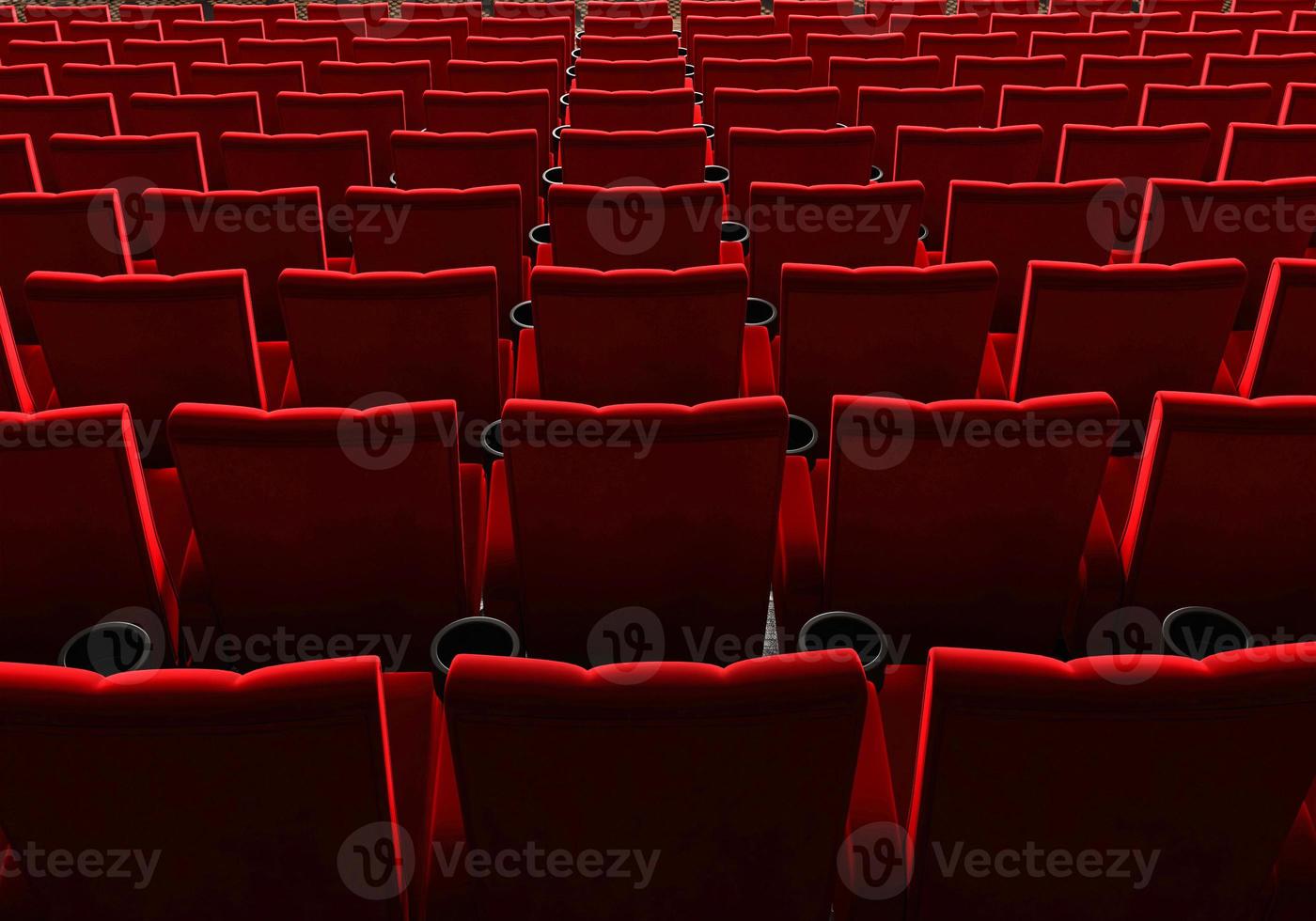 Rows of red velvet seats watching movies in the cinema with copy space banner background. Entertainment and Theater concept. 3D illustration rendering photo