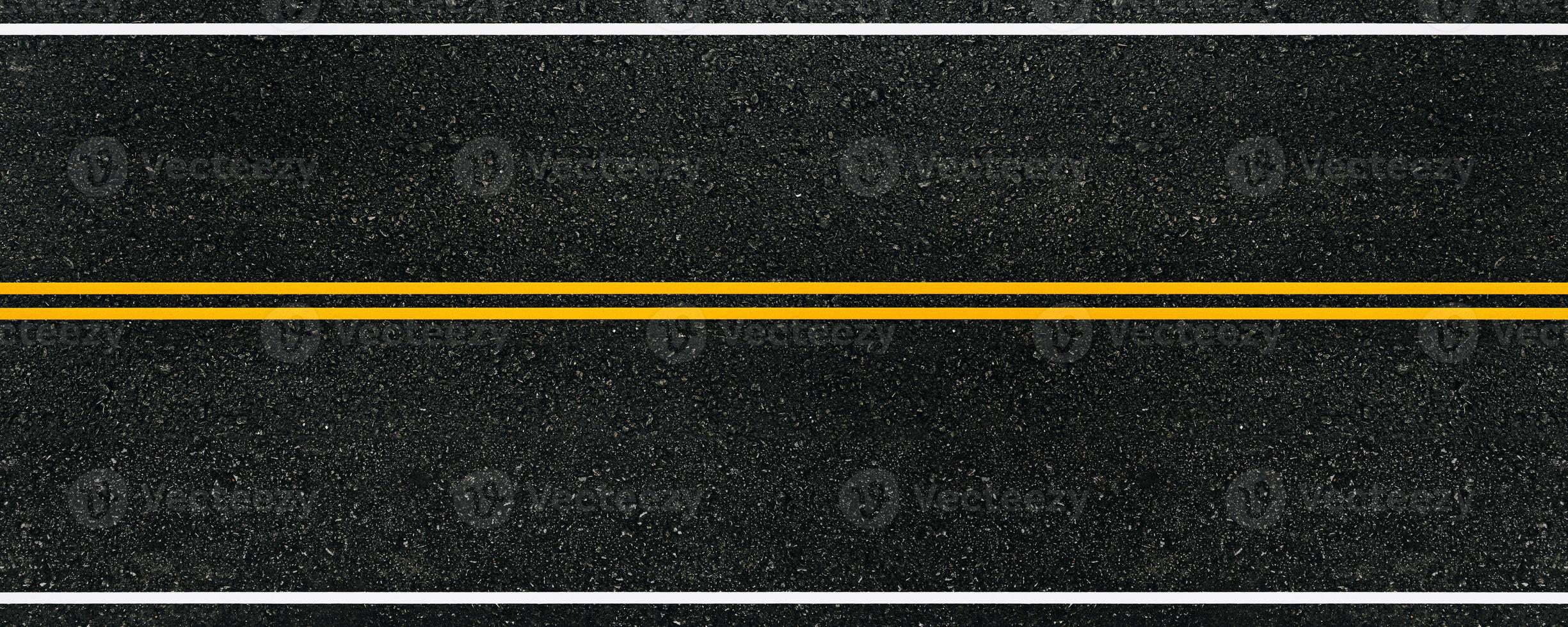 Top view empty highway with black asphalt road and no-overtaking line area for background. photo