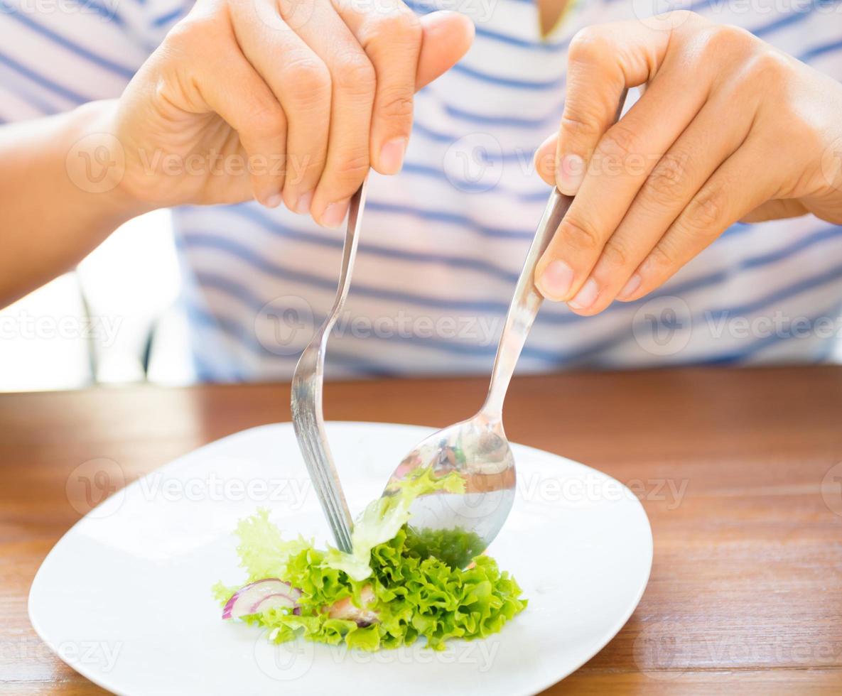 women eating fresh salad photo