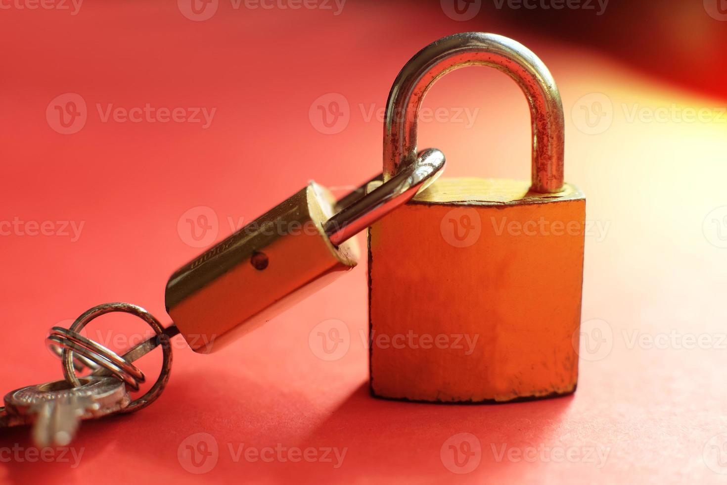 Two padlocks locked with each other photo