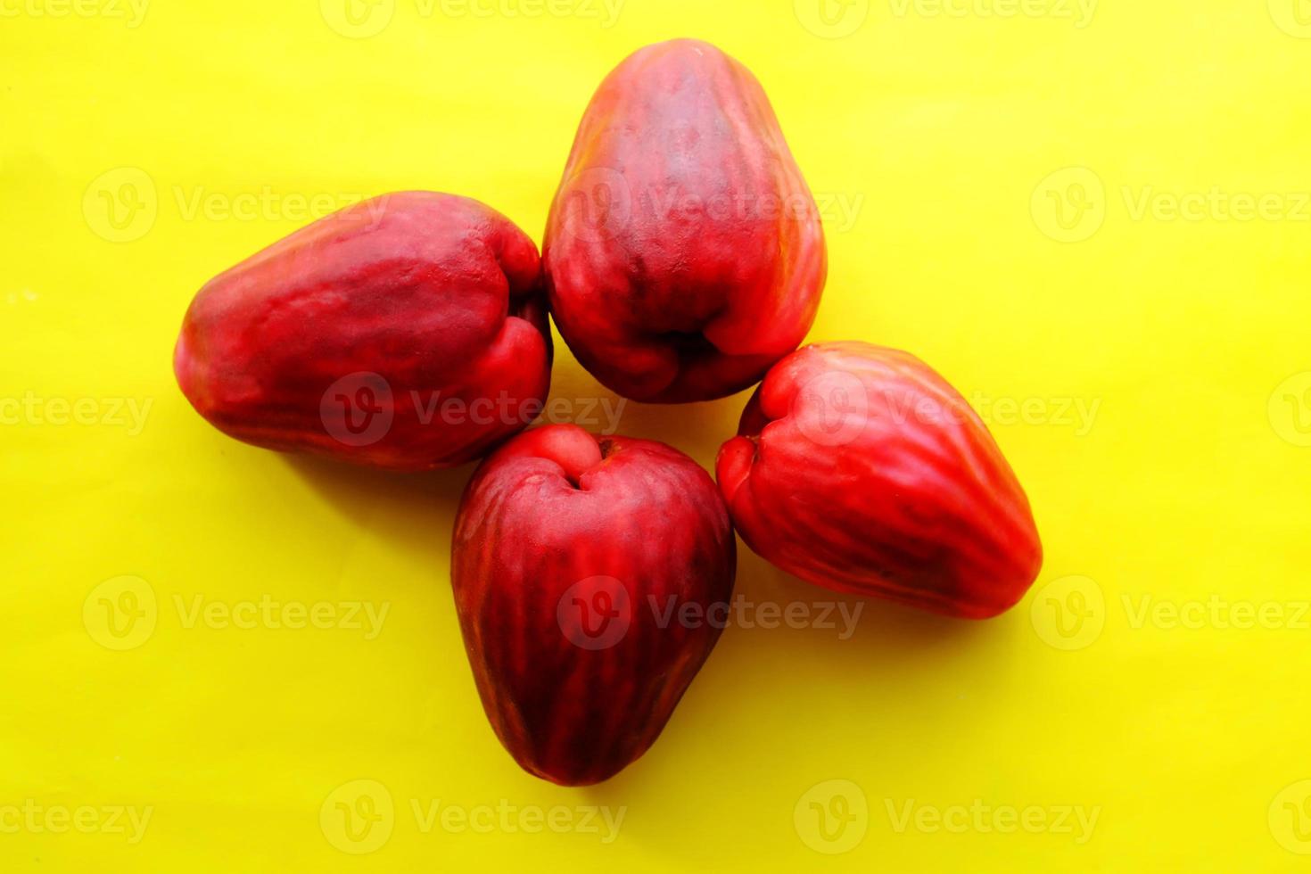 Sweet red fresh water guava on a yellow background photo