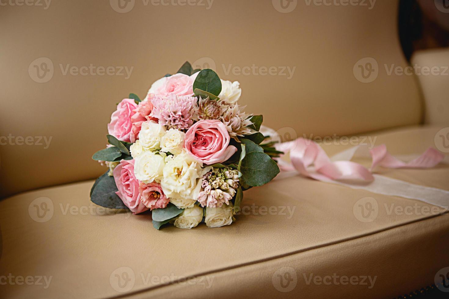 Wedding bouquet of the bride. Floristics, festive decoration of fresh flowers of the ceremony. Symbol of love, roses in pastel shades, succulents in decorative elements, wildflowers. Space for text photo