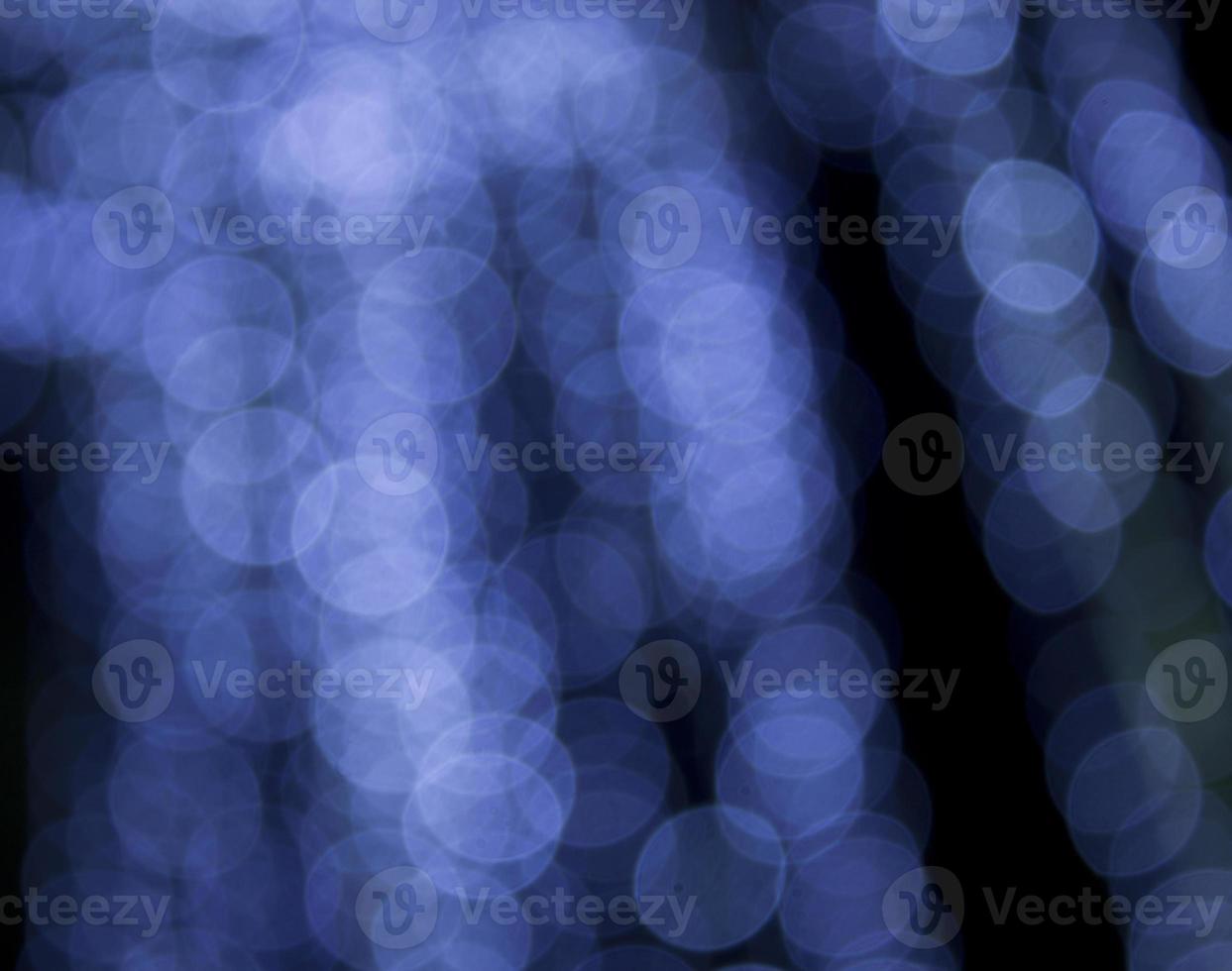 Blue Festive Christmas background. Elegant abstract background with bokeh defocused lights and stars. photo