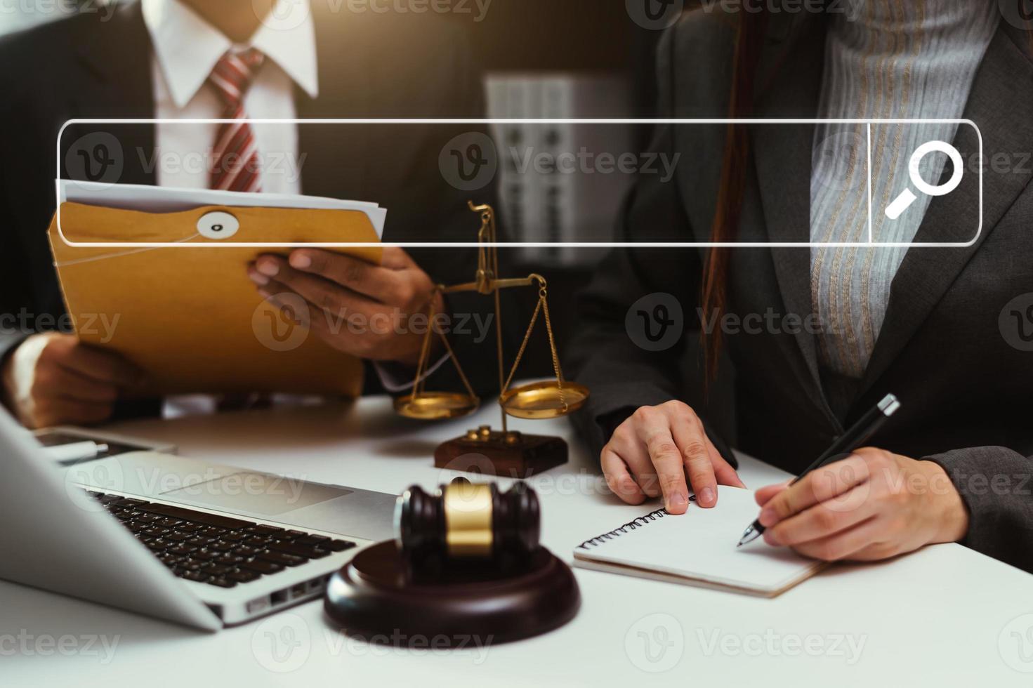 Searching Browsing Internet Data Information Networking Concept with blank search bar.justice and law concept.Male judge in a courtroom with the gavel,working with digital tablet computer. photo