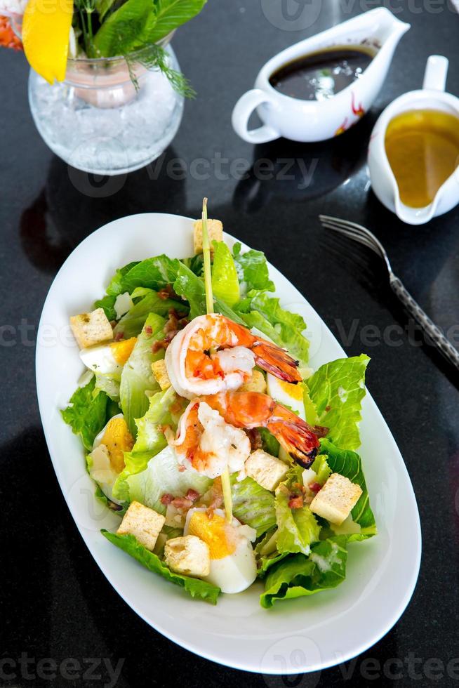 Caesar salad with prawns photo