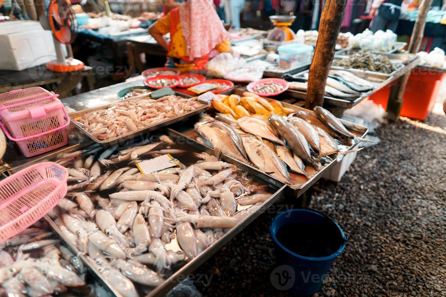 Fish market in Krabi,Raw seafood in a market near the tropical sea photo