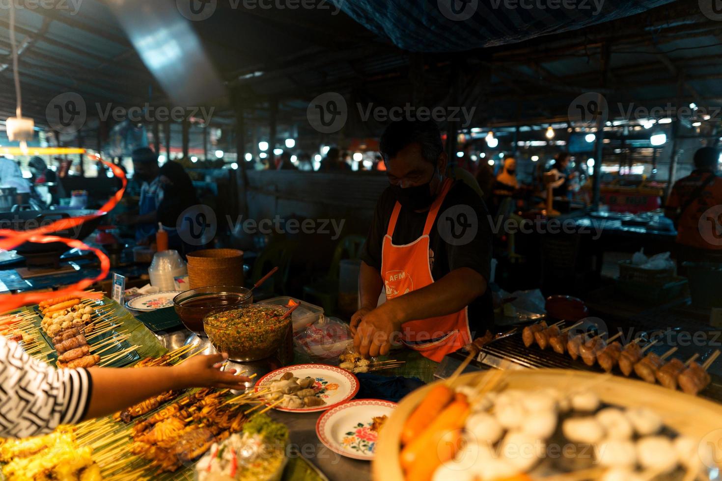 Food at a street market in the evening in Krabi photo