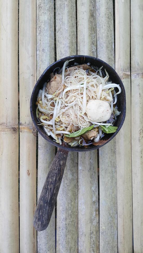 Noodles in thicken pork soup photo