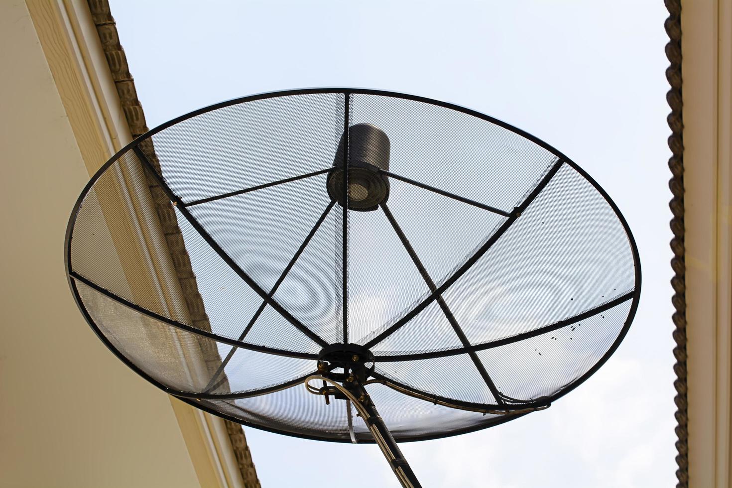 The big satellite dish is black color photo