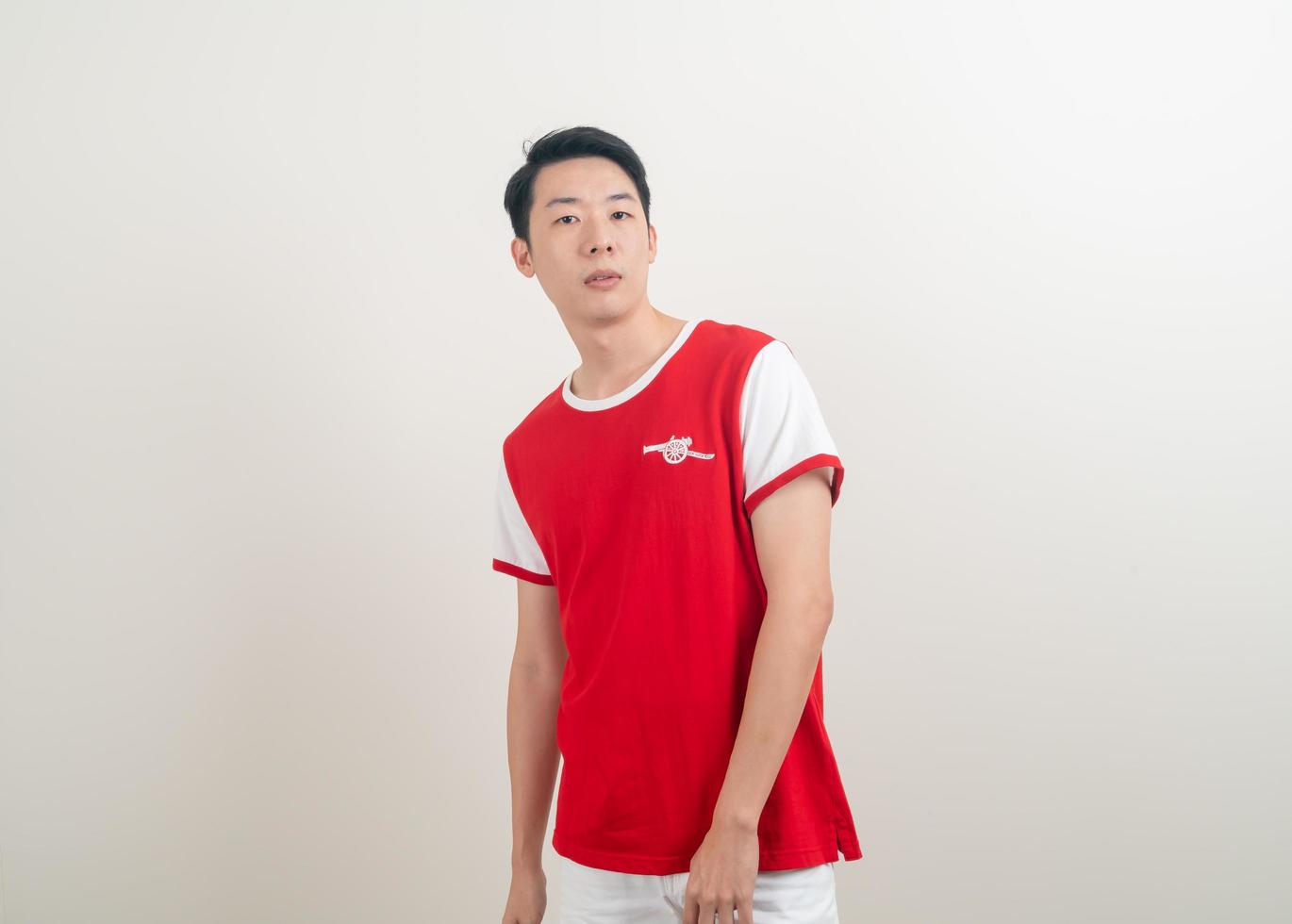 Bangkok, THAILAND - Nov 27, 2021 - Young Asian man wearing Arsenal shirt with white background. photo