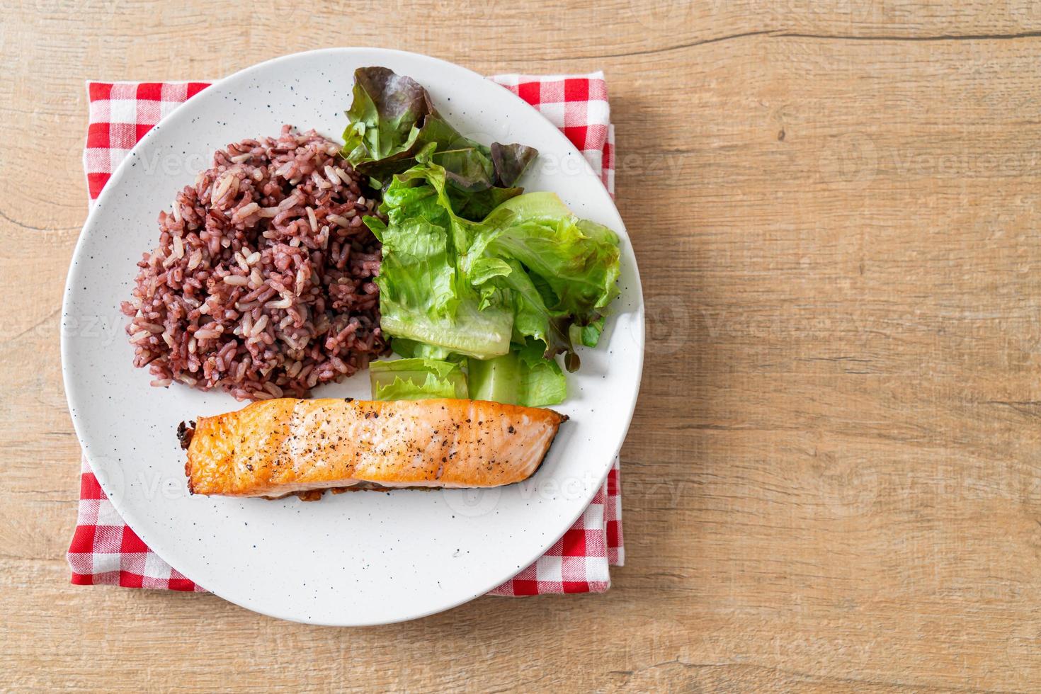 grilled salmon fillet steak with rice berry and vegetable photo