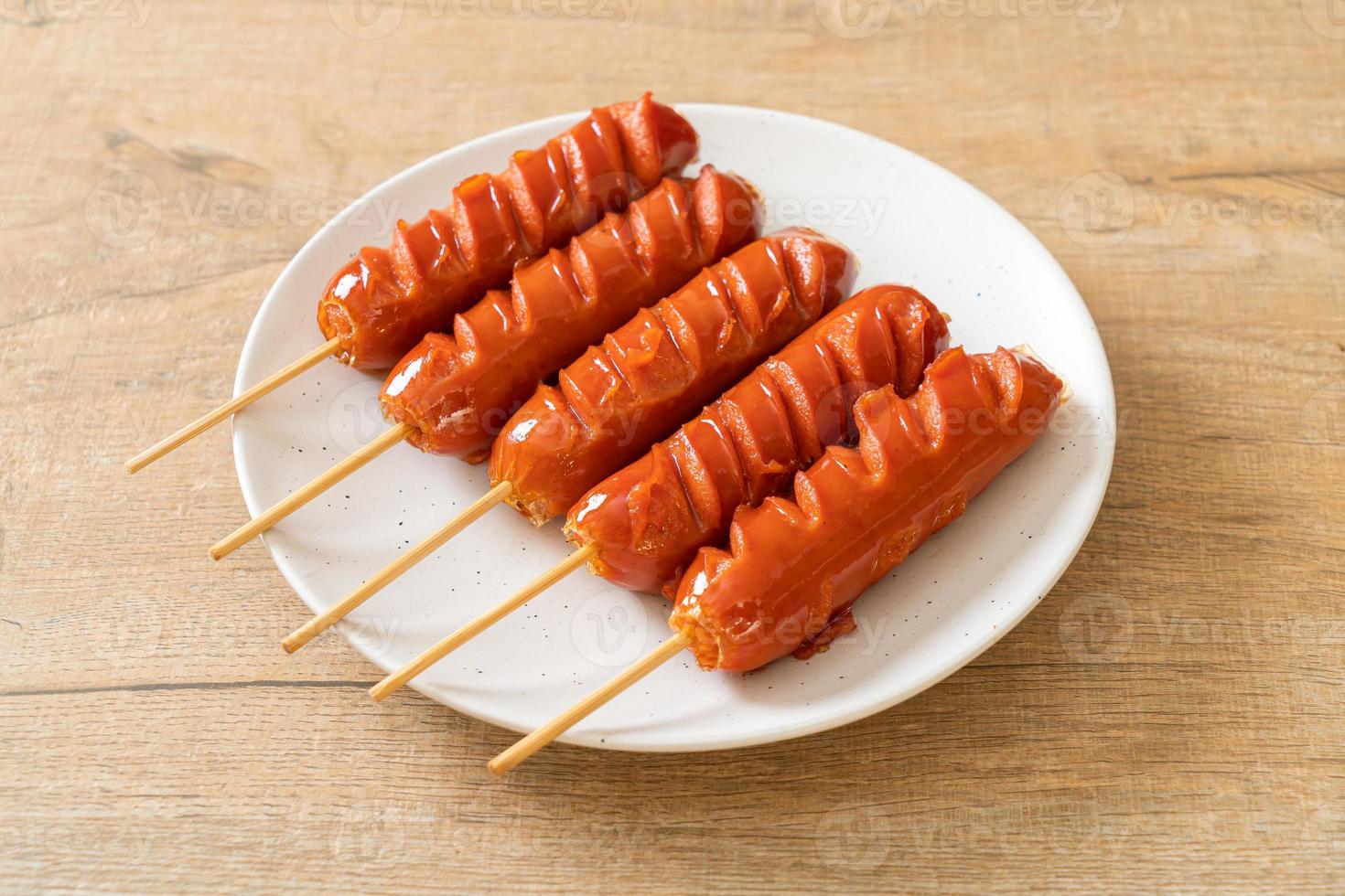 fried sausage skewer on plate photo