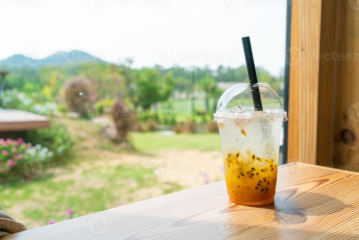 iced soda with passion fruit in glass photo