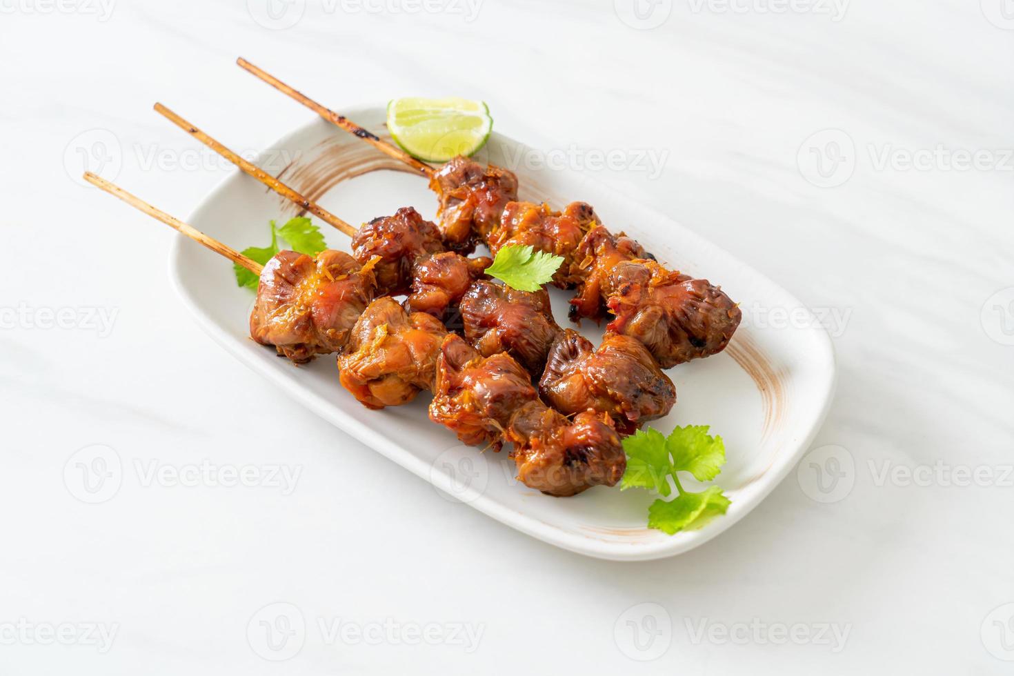 grilled chicken gizzard skewer with herbs and spices photo