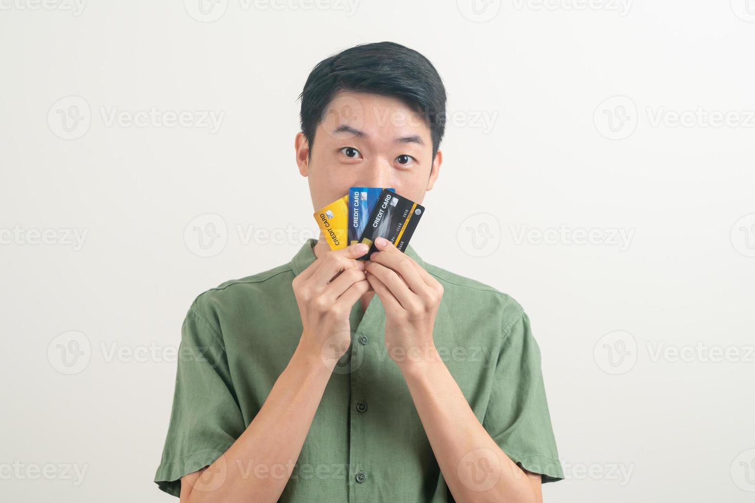 young Asian man holding credit card photo