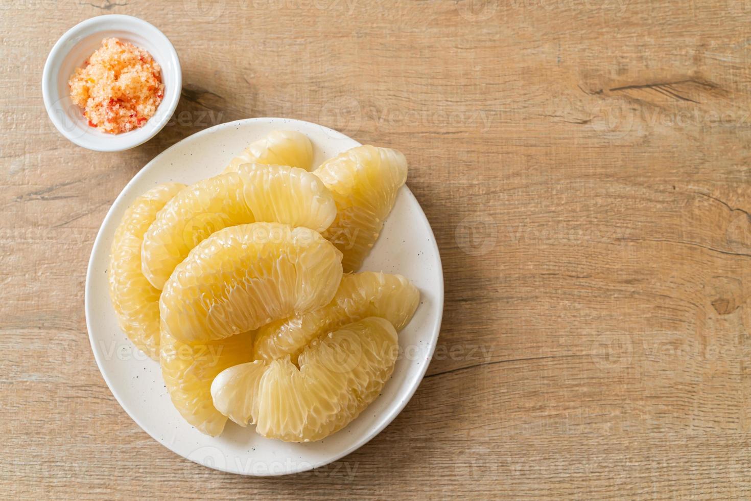 Fresh peeled pomelo, grapefruit or shaddock photo