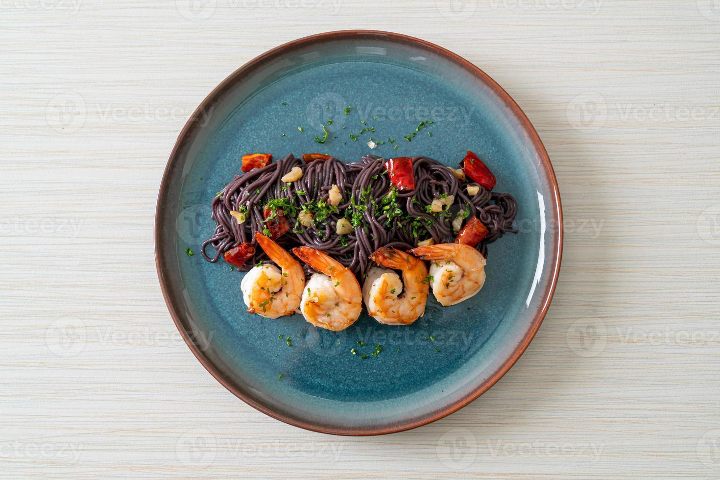 stir-fried black spaghetti with garlic and shrimps photo