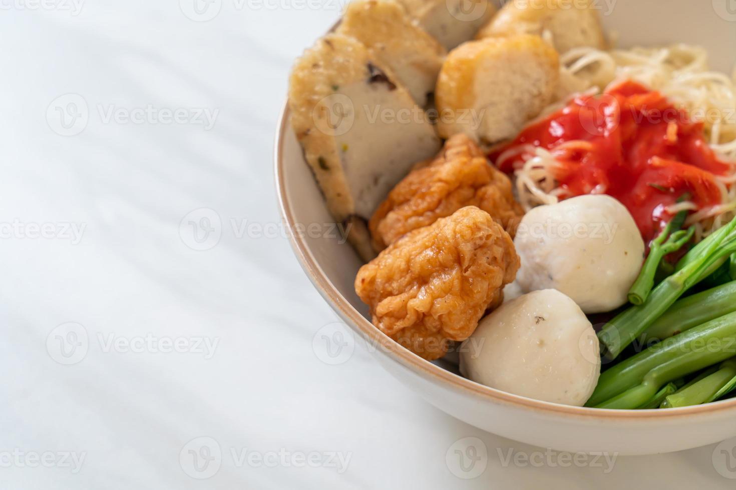 egg noodles with fish balls and shrimp balls in pink sauce, Yen Ta Four or Yen Ta Fo photo