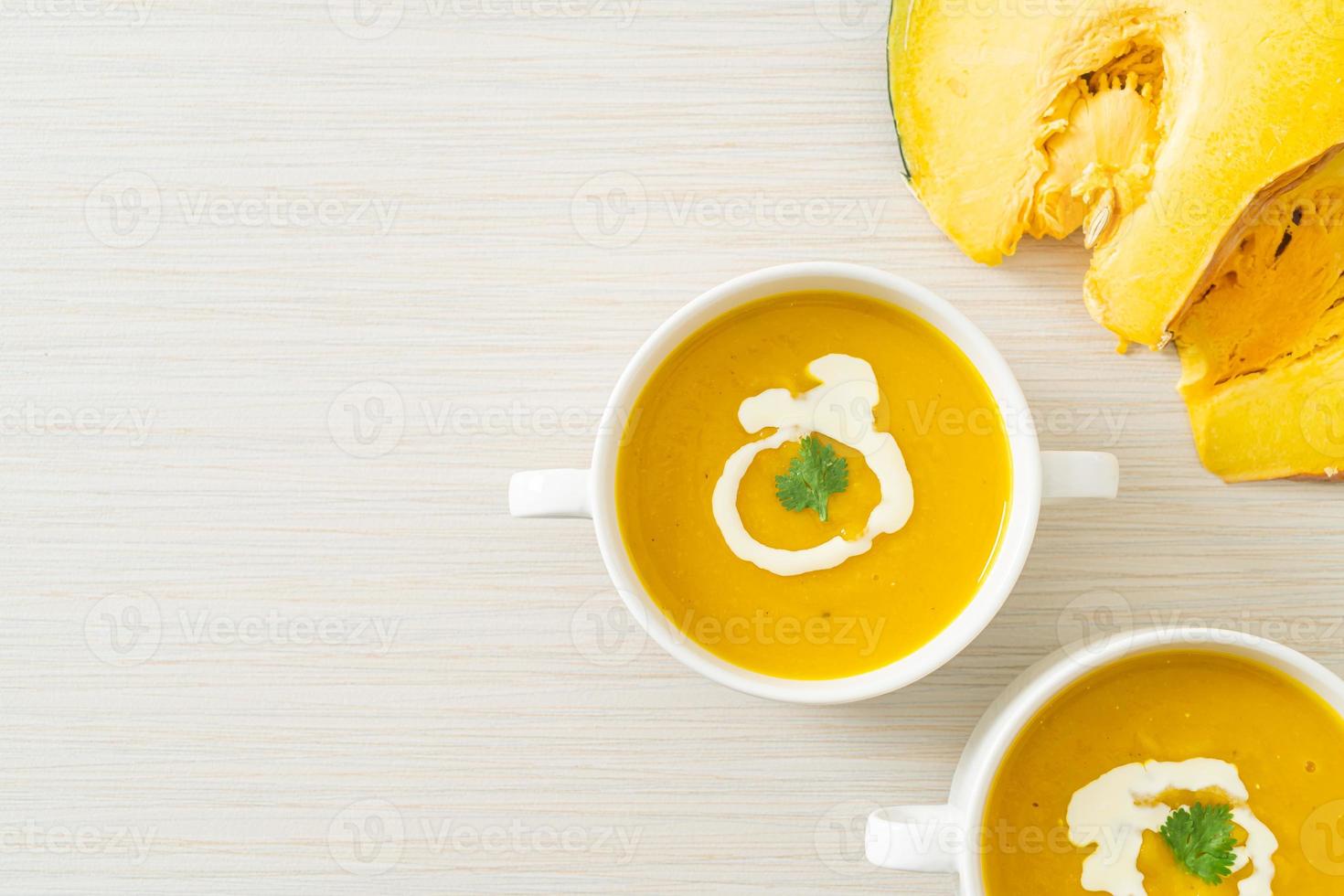 pumpkin soup in white bowl photo