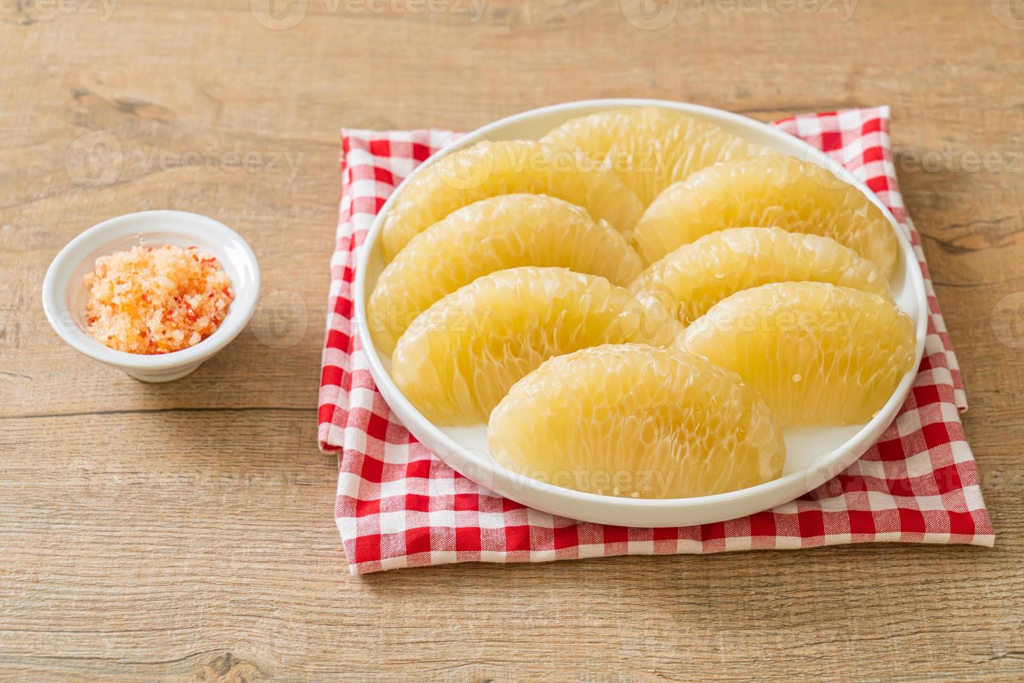 Fresh peeled pomelo, grapefruit or shaddock photo