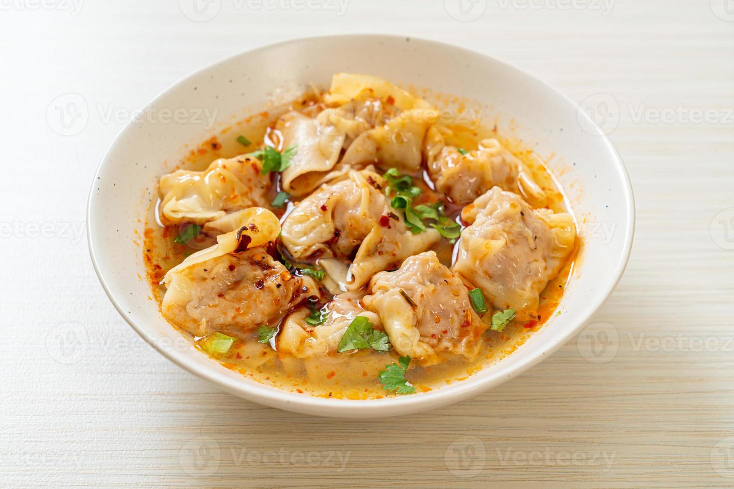 pork wonton soup or pork dumplings soup with roasted chili photo