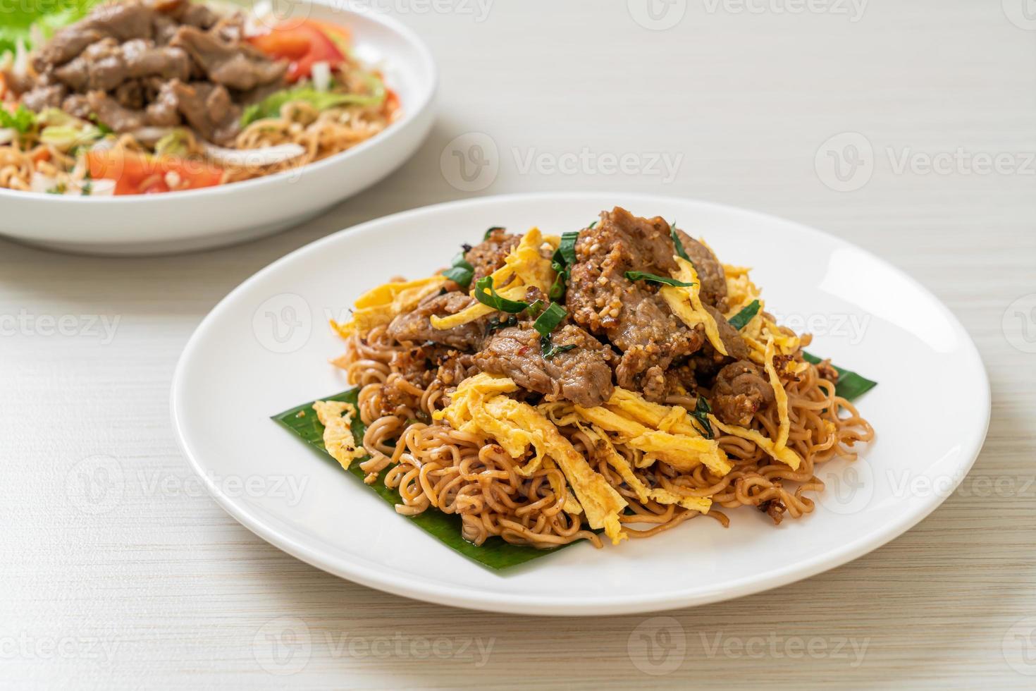 stir-fried instant noodle with pork and egg photo