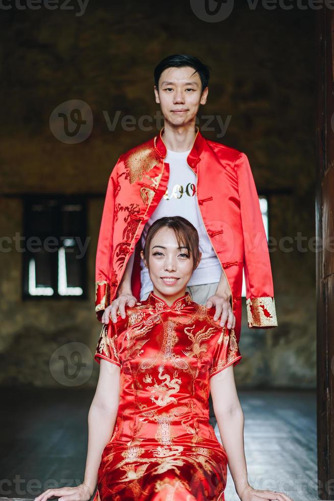 Happy young Asian couple in Chinese traditional dresses photo