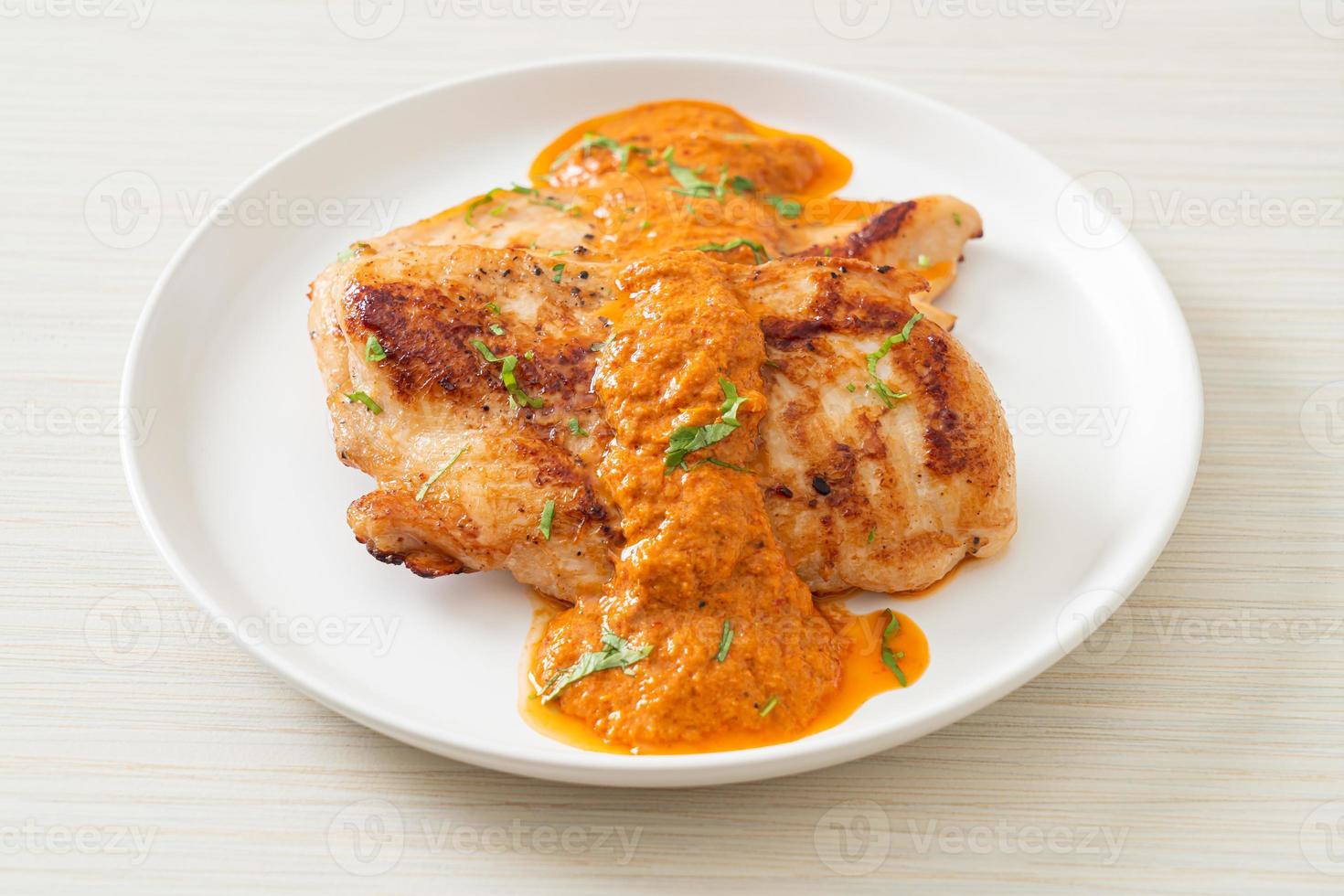 grilled chicken steak with red curry sauce photo
