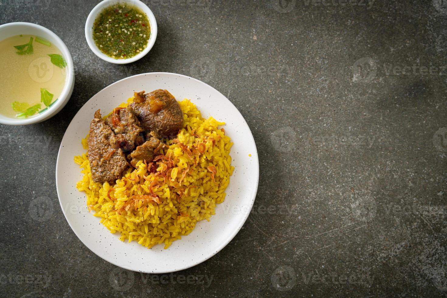 Beef Biryani or Curried rice and beef - Thai-Muslim version of Indian biryani, with fragrant yellow rice and beef photo