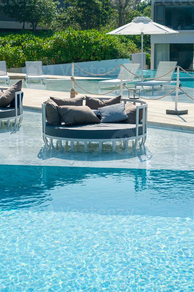 umbrella with bed pool around swimming pool photo